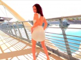 Arousing solo Dani teasing pussy on a bridge